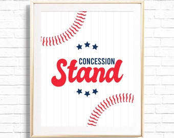 May include: A white framed print with a baseball theme. The print features a red baseball stitch design, blue stars, and the text "CONCESSION Stand" in red.