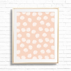 May include: A framed print with a peach background and a white seashell pattern.