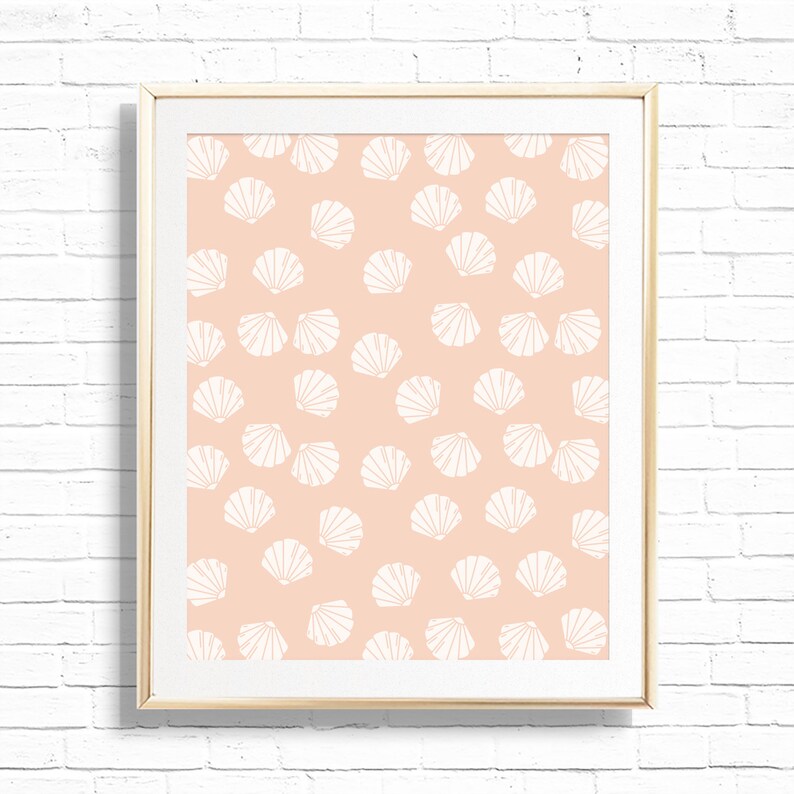 May include: A framed print with a peach background and a white seashell pattern.