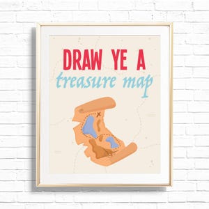 May include: A framed print with the text "DRAW YE A treasure map" in red and blue. The print features a cartoon treasure map in shades of brown and blue, with dotted lines and an "X" marking a spot.