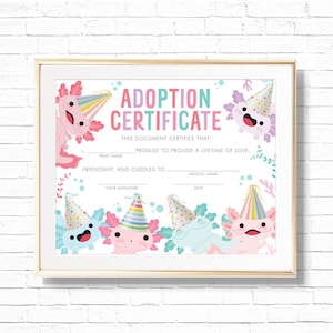 May include: A framed adoption certificate featuring colorful axolotls wearing party hats. The text "ADOPTION CERTIFICATE" is displayed in pink and teal. The certificate includes spaces for names and a promise of love.