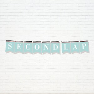 May include: A light blue banner with black and white checkered trim reads "SECOND LAP" in white letters.