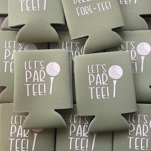 May include: A stack of green foam can coolers with white text and a golf ball graphic. The text on the coolers reads "Let's Par Tee!" and "Derrick is Fore-Tee!"