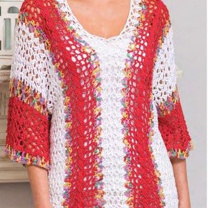 May include: A white crochet top with red, yellow, green, and purple accents. The top has a loose fit and a scoop neck.