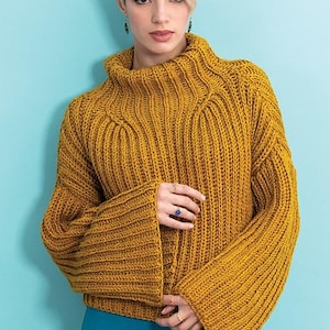 May include: A mustard yellow knitted sweater with a high neck and wide bell sleeves.