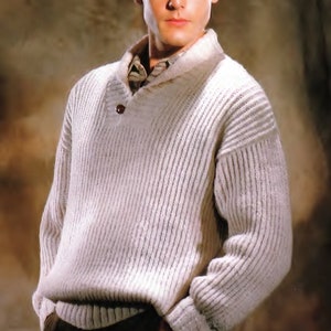 May include: A white ribbed knit sweater with a buttoned collar and long sleeves. The sweater is made of a soft, comfortable material and has a relaxed fit.