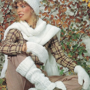 May include: A white knitted hat, scarf and leg warmers set. The hat has a simple design and the scarf is long and flowing. The leg warmers are long and have a ribbed texture.