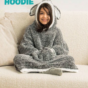 May include: A gray hooded blanket with a sheep-like design. The hood has white trim and large ears. The word "HOODIE" is printed in teal at the top. The blanket is made of a soft, plush material.