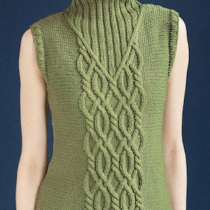 May include: A green sleeveless knitted jumper with a high neck and a cable knit pattern.