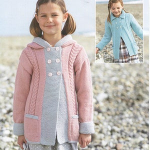 May include: A pink and light blue knitted cardigan with a hood, buttons, and pockets. The cardigan has a cable knit pattern on the sleeves and front.