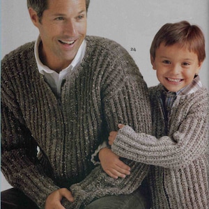 May include: Two people wearing brown and gray knitted sweaters. The sweater has a ribbed texture. The person on the left is an adult and the person on the right is a child.