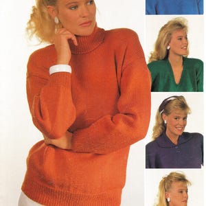 May include: An orange turtleneck jumper with long sleeves and a white bracelet. Additional images show a blue crew neck jumper, a green V-neck jumper, a purple collared jumper, and a yellow turtleneck jumper.