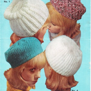 May include: Four different crochet hats in white, pink, blue, and white. The hats are worn by four different models with blonde hair. The hats are labeled with numbers 1 through 4.