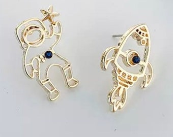 Space man and rocket earrings set.