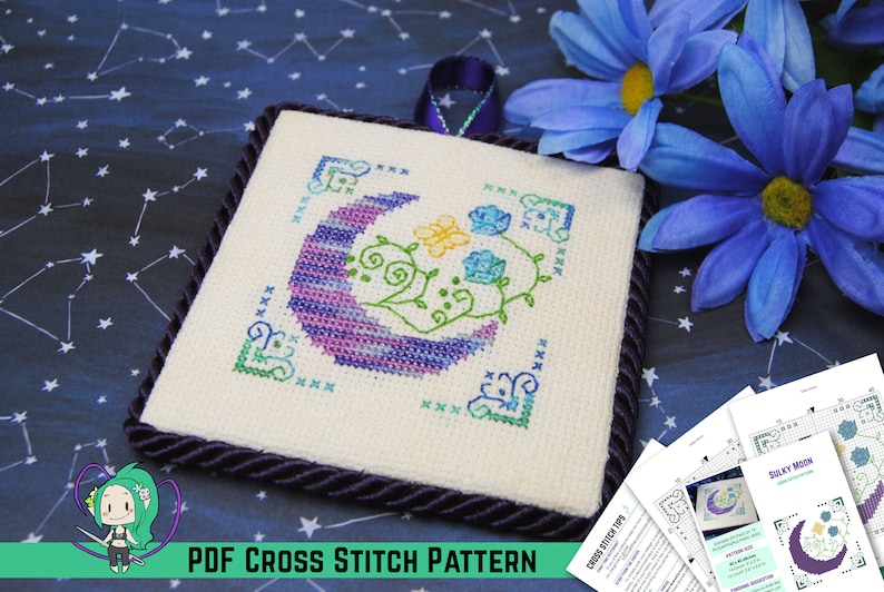 May include: Square cross-stitch pattern featuring a crescent moon design in shades of purple and blue, with floral accents. The design is framed with a decorative border and a purple cord trim. The text "PDF CROSS STITCH PATTERN" is visible.