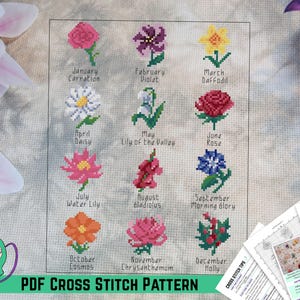 May include: A cross-stitch pattern featuring 12 different flowers, each representing a month of the year. The flowers include a carnation, violet, daffodil, daisy, lily of the valley, rose, water lily, gladiolus, morning glory, cosmos, chrysanthemum, and holly. The text "PDF CROSS STITCH PATTERN" is at the bottom.