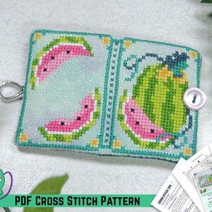 May include: A PDF cross stitch pattern for a watermelon-themed needle minder. The pattern includes a watermelon slice and a whole watermelon with green stripes and a vine.