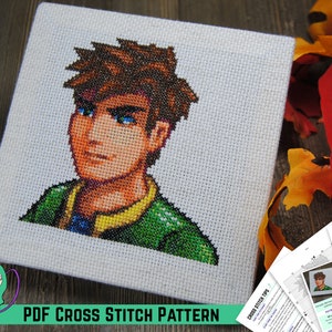 Op de afbeelding: Een kruissteekpatroon van een gepixelde portret van een persoon met bruin haar, blauwe ogen en een groen shirt. Het patroon is gedrukt op wit papier en bevat instructies voor het borduren. De afbeelding bevat ook de tekst "PDF CROSS STITCH PATTERN" en "CROSS STITCH TIPS".