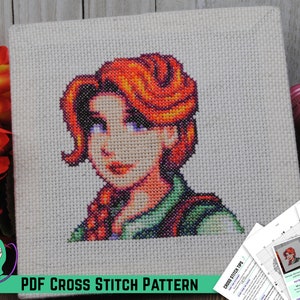 May include: A cross stitch pattern of a woman with red hair and a green shirt. The pattern is on a white canvas and is framed with a wooden frame. The pattern is labeled "PDF CROSS STITCH PATTERN".