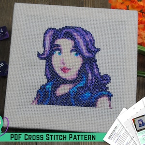 May include: A cross stitch pattern of a purple-haired woman with blue eyes. The pattern is on a white canvas and is surrounded by dice. The text "PDF CROSS STITCH PATTERN" is at the bottom of the image.