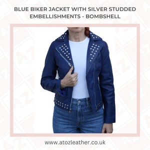 May include: A blue leather biker jacket with silver studded embellishments. The jacket has a zipper closure and a collar. The model is wearing blue jeans.