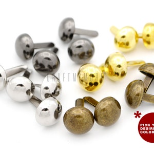 May include: Assortment of metal dome-shaped nailheads in silver, gold, and bronze finishes.  The nailheads have a hammered texture and are ideal for adding a decorative touch to crafts and projects.