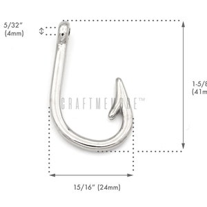 May include: Silver-toned metal hook charm, measuring 1-5/8 inches in length and 15/16 inches in width. The hook is a simple design with a rounded point and a loop at the top.