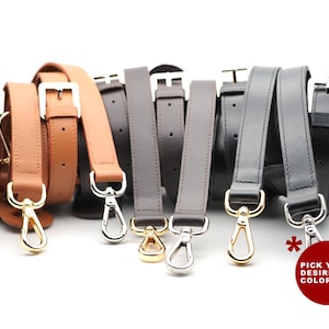 Może przedstawiać: Zestaw pięciu skórzanych pasków ze złotymi i srebrnymi klamrami. Paski są dostępne w kolorze brązowym, czarnym i szarym. "Wybierz swój ulubiony kolor!" napisano na czerwono na białej gwiazdce.