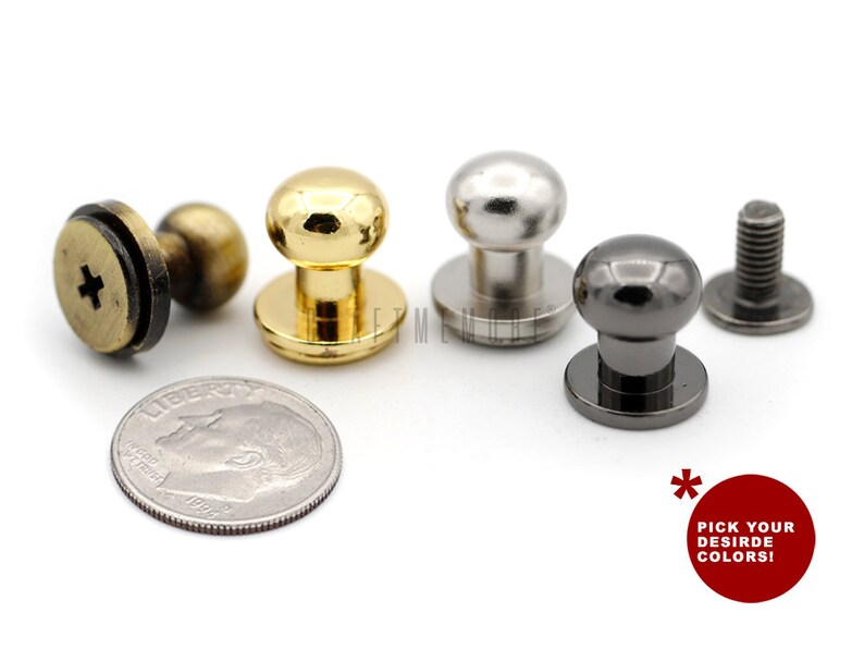 May include: Four metal push buttons in gold, silver, and black. The buttons are round with a flat base and a raised dome. The buttons are about the size of a US dime.
