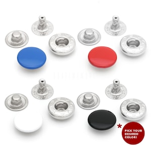 May include: Assortment of snap buttons in various colors, including black, white, red, and blue. The buttons are made of metal and have a shiny finish. Each button has a raised center and a decorative rim. The buttons are arranged in a grid pattern on a white background. Pick your desired color!