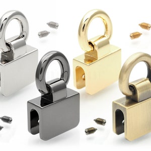 Op de afbeelding: Vier draaibare metalen haken met een vierkante basis en een ring aan de bovenkant. De haken zijn in zilver, goud, zwart en antiek messing.