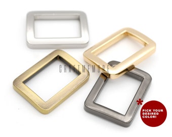 May include: Four metal rectangular rings in different finishes: silver, gold, brass, and gunmetal.  Pick your desired color!
