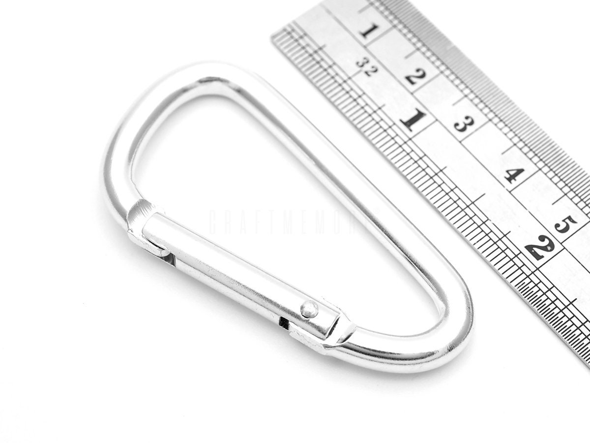 Carabiner key chain attaches to your bag or briefcase. Spring-hinge allows  easy release of the clip and quick access to keys. Carabiner key chain  mimics the look of the climber clip but