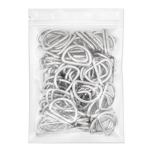 May include: A clear plastic bag filled with silver metal D-rings. The D-rings are all the same size and are arranged in a random pattern.
