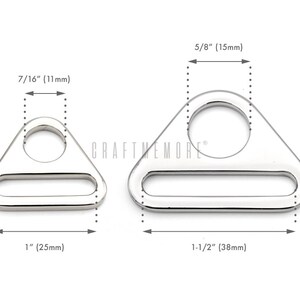 May include: Two silver triangle-shaped metal rings with a round hole and a rectangular opening. The smaller ring measures 1 inch wide and 7/16 inch tall. The larger ring measures 1 1/2 inches wide and 5/8 inch tall.