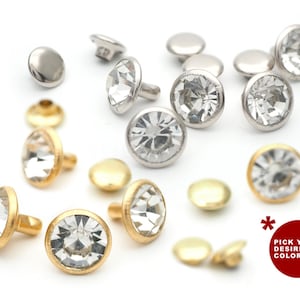 May include: Assortment of clear crystal rhinestones with gold and silver settings. The rhinestones have a faceted design and are available in a variety of sizes.  Pick your desired color.