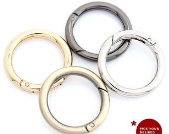 May include: Four swivel snap hooks in different finishes: gold, silver, black, and antique brass.  Pick your desired color!