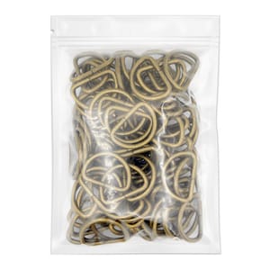May include: A clear plastic bag filled with a large quantity of gold-toned metal D-rings. The D-rings are approximately 1 inch in diameter.