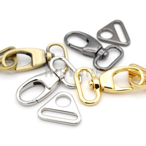 May include: Three metal swivel clasps with triangular loops. The clasps are in gold, silver, and nickel finishes.