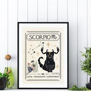 May include: A black and gold framed print with a vintage style illustration of a scorpion constellation with the text "Scorpio m" and the words "Loyal - Passionate - Commitment" at the bottom.