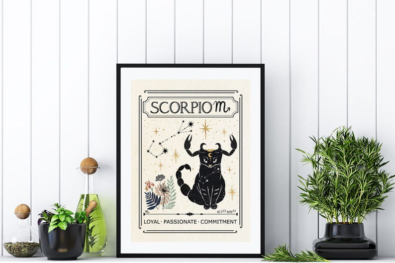 May include: A black and gold framed print with a vintage style illustration of a scorpion constellation with the text "Scorpio m" and the words "Loyal - Passionate - Commitment" at the bottom.