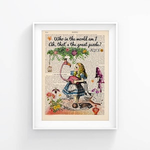 May include: Alice in Wonderland illustration featuring Alice holding a pink flamingo, a quote from the book, "Who in the world am I Ah, that's the great puzzle?" and the word "ALICE" printed below the quote.