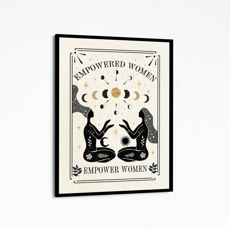 May include: Black and white illustration of two women sitting back to back with their hands raised. The women are surrounded by a gold moon and stars. The text "EMPOWERED WOMEN" is above the women and "EMPOWER WOMEN" is below the women.