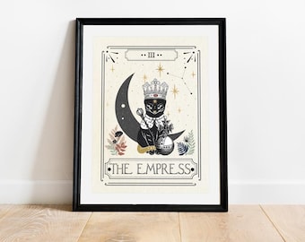 May include: A tarot card illustration featuring a black cat wearing a crown and sitting on a crescent moon. The card is titled "The Empress" and has the Roman numeral "III" above the title.