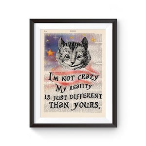 May include: A vintage book page with a Cheshire Cat illustration and the quote "I'm not crazy, my reality is just different than yours."