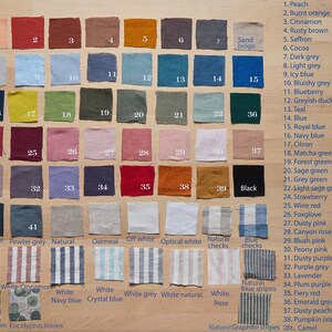 May include: A color chart of 39 fabric swatches, each with a number and a name. The swatches are arranged in rows and columns, and the names are listed on the right side of the chart. The colors include peach, burnt orange, cinnamon, rusty brown, saffron, cocoa, dark grey, light grey, icy blue, bluishy grey, blueberry, greyish duck egg, teal, blue, royal blue, navy blue, citron, matcha green, forest green, sage green, grey green, light sage green, strawberry, wine red, foxglove, dusty pink, canyon rose, blush pink, peony pink, dusty purple grey, purple grey, lavender, plum purple, fiery red, emerald green, dusty peach, pumpkin orange, and camel.