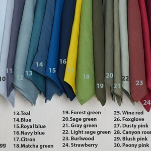 May include: A swatch card with 33 different fabric samples in various colors, including peach, burnt orange, cinnamon, rusty brown, saffron, cocoa, dark grey, light grey, icy blue, bluishy grey, blueberry, grayish duck egg, teal, blue, royal blue, navy blue, citron, matcha green, forest green, sage green, gray green, light sage green, burlwood, strawberry, wine red, foxglove, dusty pink, canyon rose, blush pink, peony pink, dusty purple grey, purple grey, and lavender.