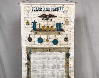May include: A vintage 1965 kitchen calendar tea towel with a brick wall background. The towel features a fireplace with a shelf above it, and a variety of kitchen utensils hanging from the shelf. The text "Peace and Plenty" is at the top of the towel, and the text "Home and Hearth" is at the bottom.