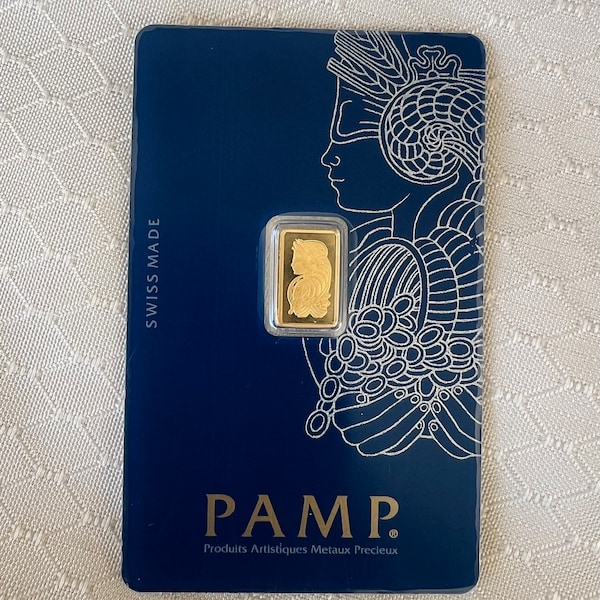 24K Pretty Yellow Gold 999.9 1 Gram Pamp Suisse Gold Bar new in plastic cover with regular 14k yellow gold regular FRAME bezel