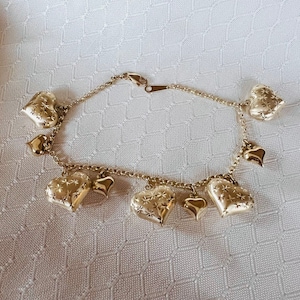 14K Yellow Gold Puffy Heart Rolo Link Style bracelet With shiny and Etched heart charms dangling
